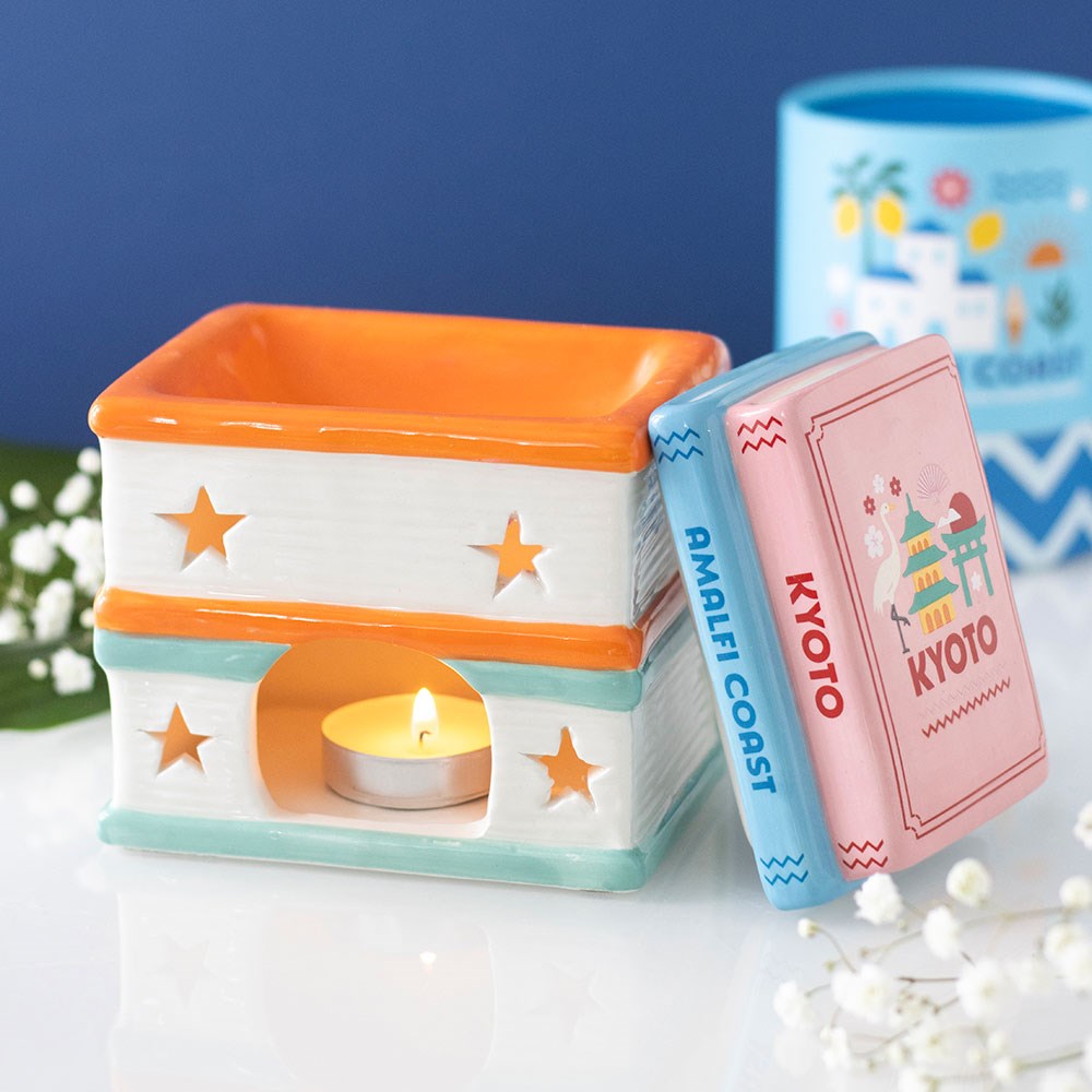 Colourful travel guide book stack wax melt burner for home fragrance