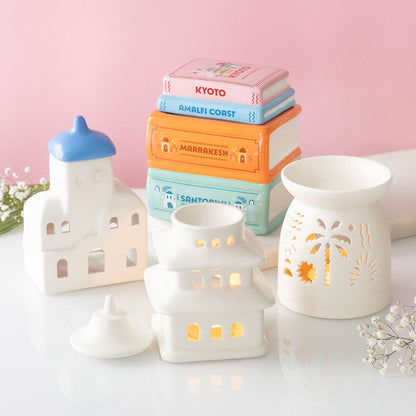 Holiday Book Stack wax warmer styled with scented wax melts and home décor