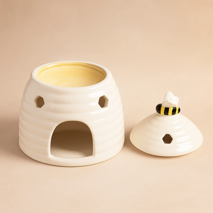 Beehive design white ceramic wax melt burner, tealight lit, cosy neutral decor ideal for minimalist UK homes