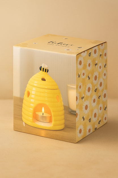 Ceramic bee-themed wax melt burner in warm neutral setting