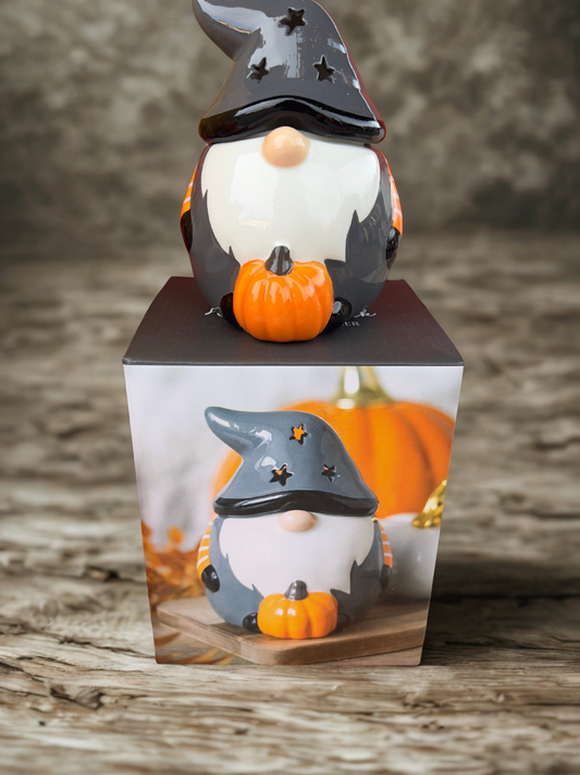 Halloween gonk/gnome wax melt burner with star cutout hat and pumpkin accent, ceramic oil burner for spooky home décor.