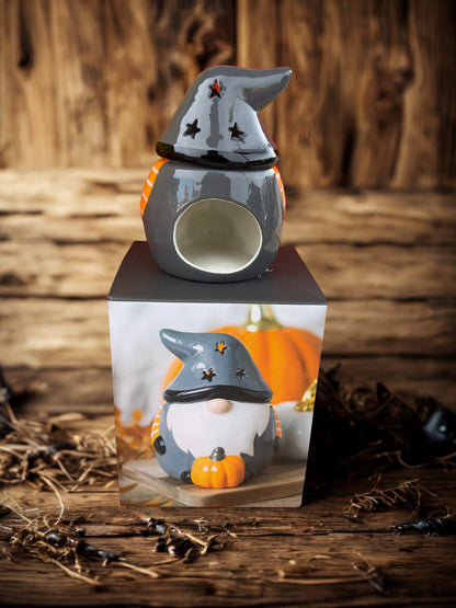 Ceramic Halloween gonk/gnome oil burner for wax melts, festive star design and pumpkin detail for seasonal decoration.