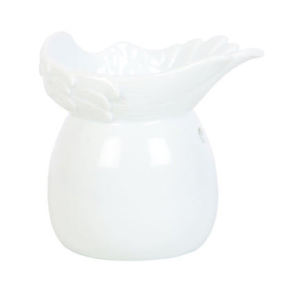 Elegant white ceramic angel wing oil burner and wax melt warmer, perfect for creating a cosy, peaceful atmosphere in a bedroom or living room