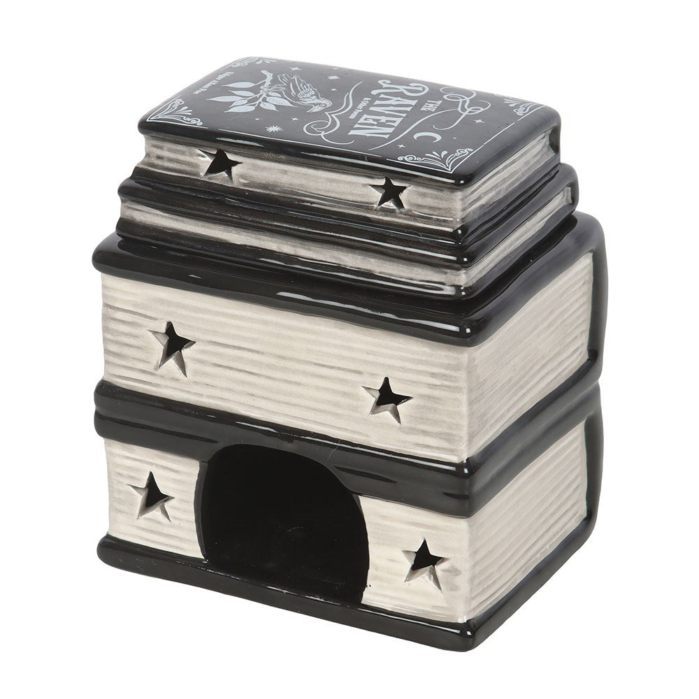 Gothic-inspired Book of Spells ceramic wax melt burner featuring a mystical stacked book design, perfect for cosy home fragrance and Halloween décor.