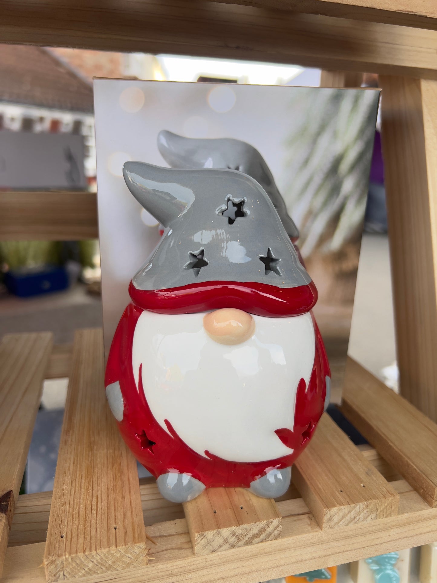 Ceramic Santa Gonk wax melt and oil burner with festive red and white outfit, tall grey hat featuring star-shaped cutouts, designed for Christmas home décor and fragrance use.