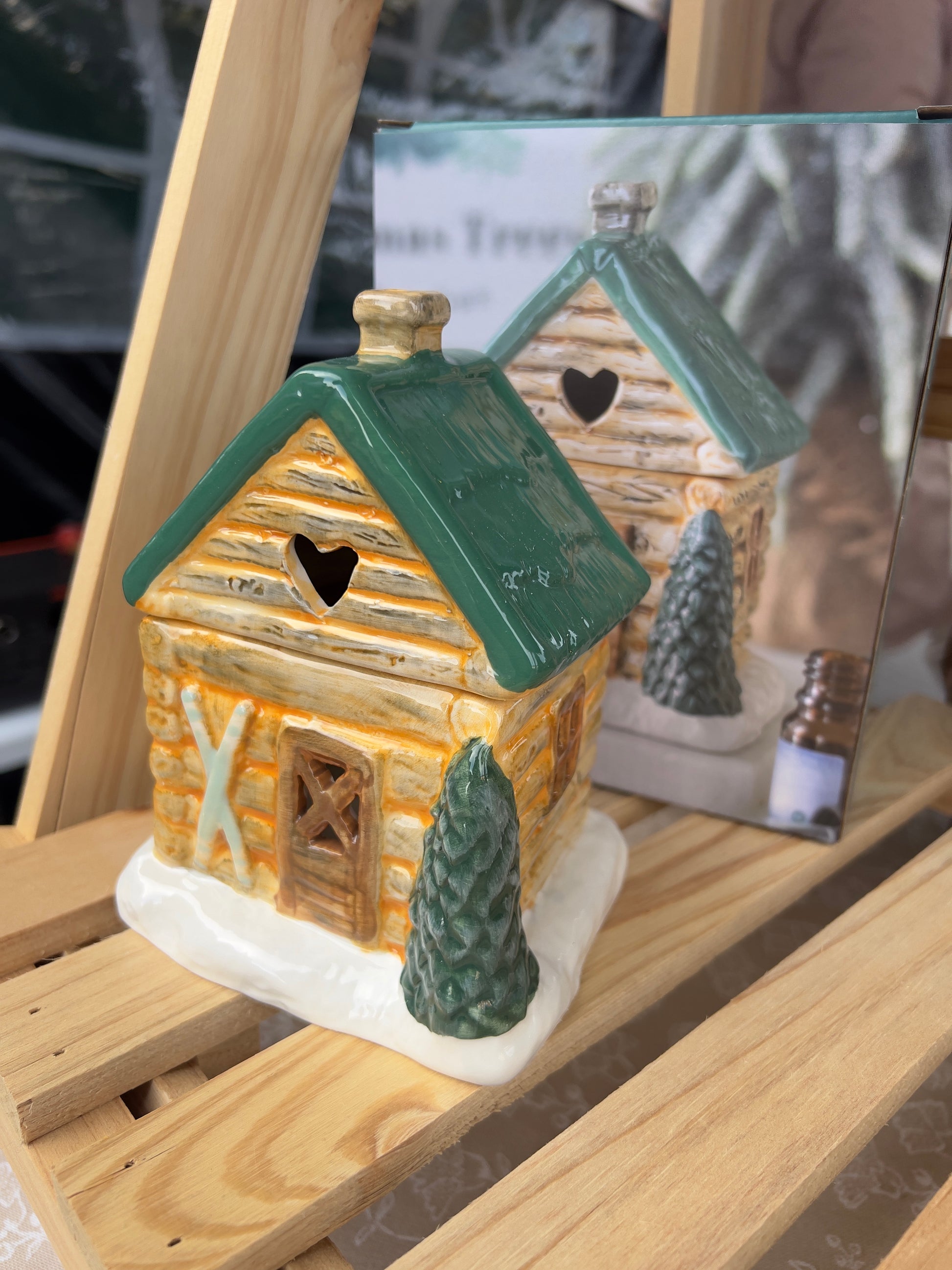 Rustic Ski Chalet wax melt burner in ceramic with snow-covered design and detachable roof for easy wax or oil use.