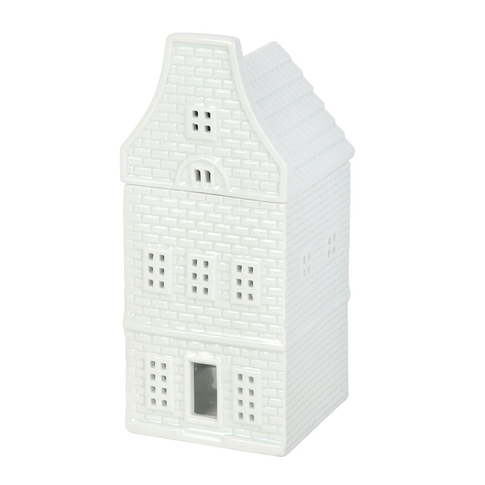 White Scandinavian house wax warmer with cut-out windows for cosy home fragrance